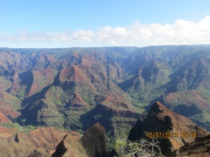 Kauai is the oldest Hawaiian island.  It's rock is red whereas Hawaii (the big island) has the black rock which is the more recent lava. 